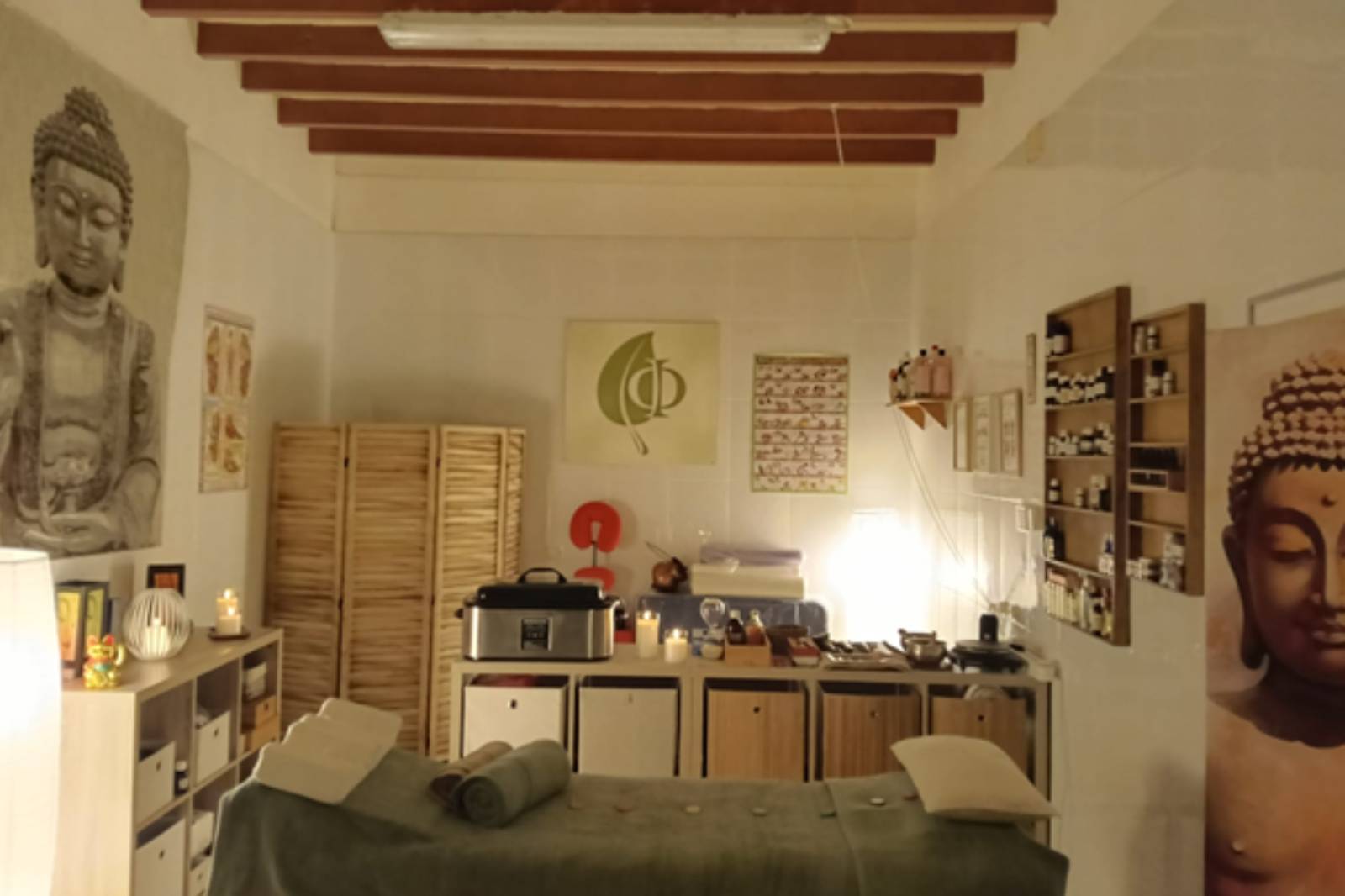 a man and a woman sitting at a table with a laptop